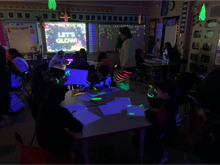 students working in a glow party 