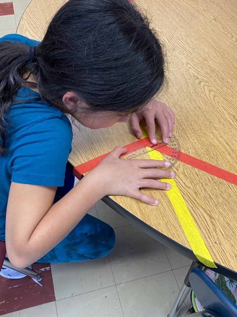 4th grade students measuring angles with colored tape