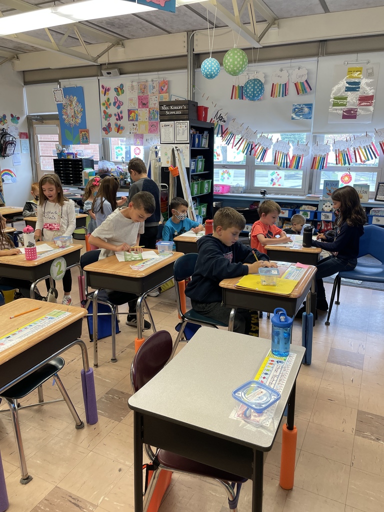 First grade students playing school during indoor recess