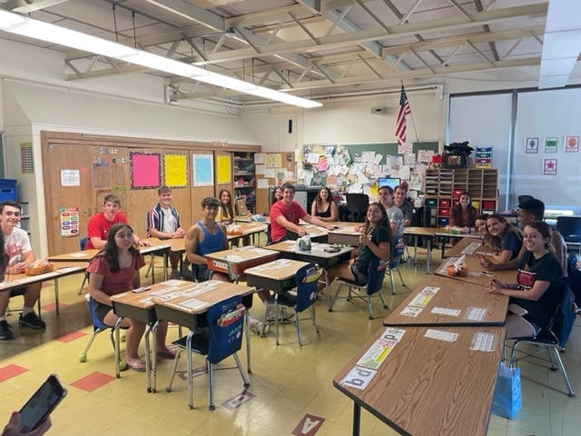 Senior class 2022 sitting in their kindergarten classroom