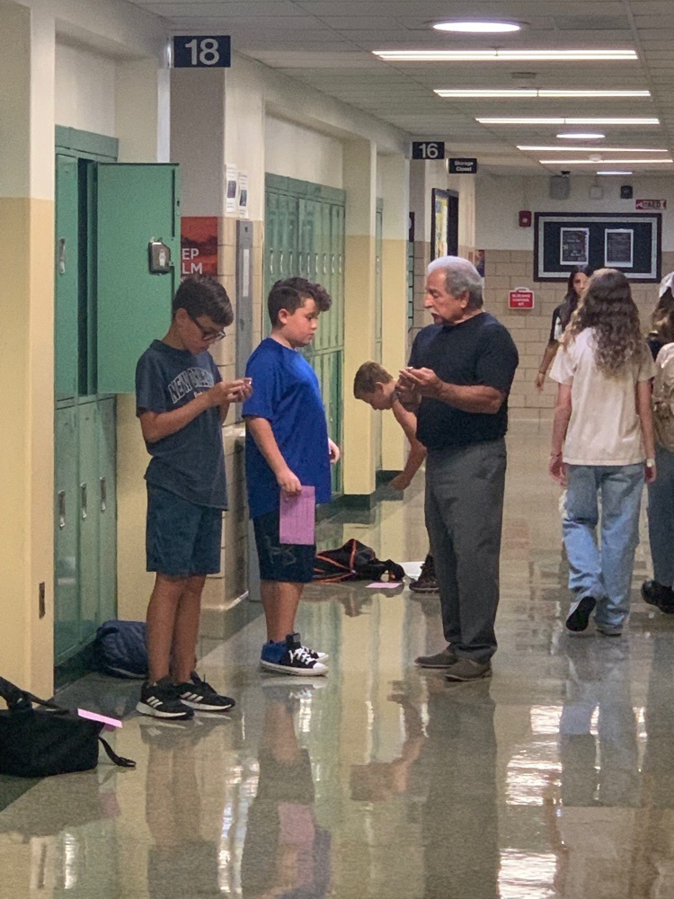Mr. D helps students with their locks