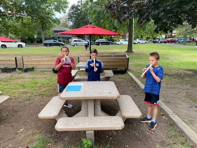 Students playing their recorders