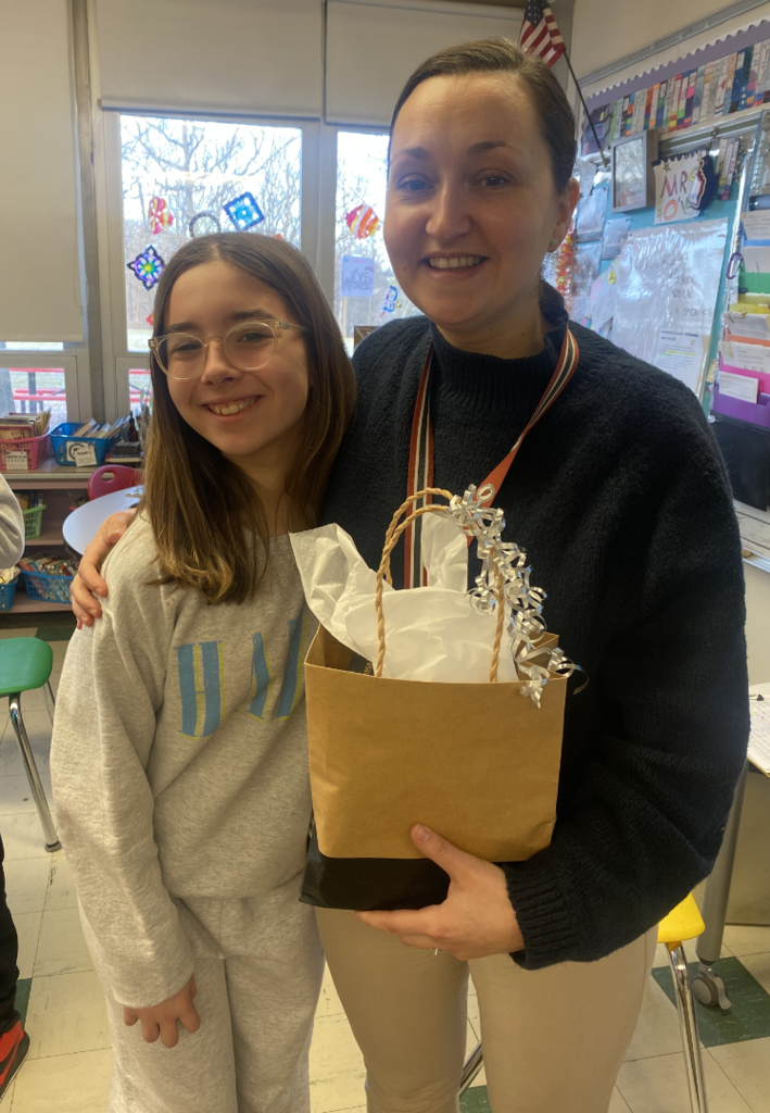 Staff wellness January winner, Mrs. Connelly and her student celebrate having won the January challenge! 