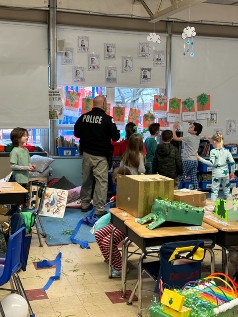 Officer Nick was called to our kindergarten classrooms to help investigate the mess made by the LEPRECHAUN this morning! #JustFocusonGrowing