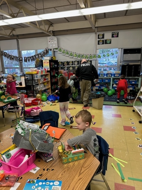 Officer Nick was called to our kindergarten classrooms to help investigate the mess made by the LEPRECHAUN this morning! #JustFocusonGrowing