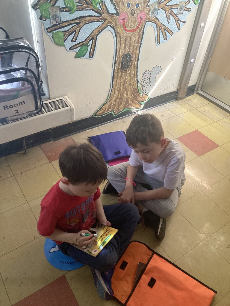 Our Kindergartener students earned their way to "GLOW DAY!" Here they are increasing partner reading skills with some flashlight fun! #JustFocusonGrowing